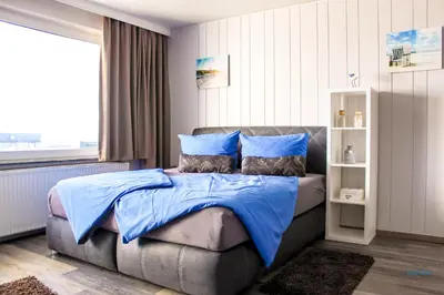 Ein Bett oder Betten in einem Zimmer der Unterkunft Haus Atlantic Whg. 607A