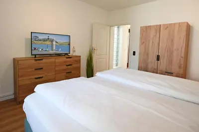 Ein Bett oder Betten in einem Zimmer der Unterkunft Strandhotel Salty