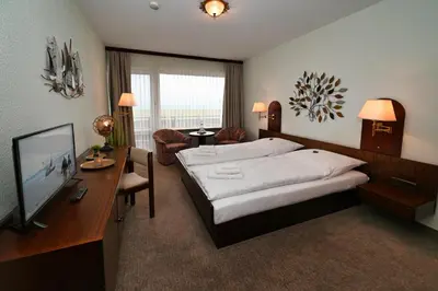 Ein Bett oder Betten in einem Zimmer der Unterkunft Strandhotel Salty