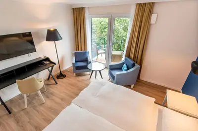Ein Bett oder Betten in einem Zimmer der Unterkunft Boutique-Hotel Zur alten Post