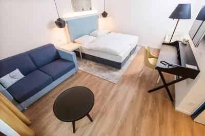 Ein Bett oder Betten in einem Zimmer der Unterkunft Boutique-Hotel Zur alten Post