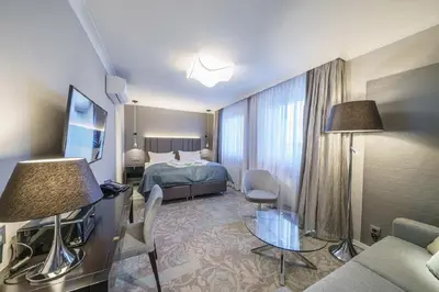 Ein Bett oder Betten in einem Zimmer der Unterkunft Strandhotel Duhnen