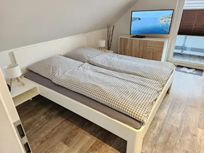 Ein Bett oder Betten in einem Zimmer der Unterkunft Appartementhaus Kogge Wohnung 8