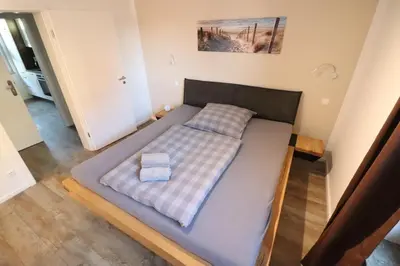 Ein Bett oder Betten in einem Zimmer der Unterkunft Appartementhaus Kogge Wohnung 10