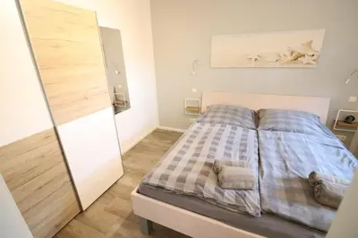 Ein Bett oder Betten in einem Zimmer der Unterkunft Appartementhaus Kogge Wohnung 10