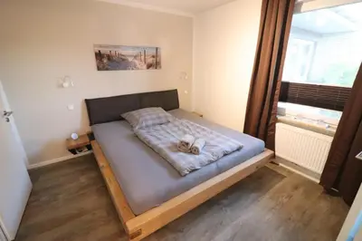 Ein Bett oder Betten in einem Zimmer der Unterkunft Appartementhaus Kogge Wohnung 10
