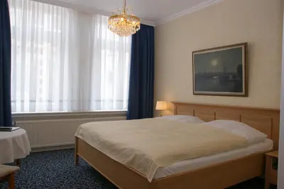 Ein Bett oder Betten in einem Zimmer der Unterkunft Hotel Beckröge