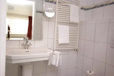 Ein Badezimmer in der Unterkunft Hotel Beckröge