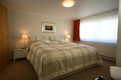Ein Bett oder Betten in einem Zimmer der Unterkunft Hotel Beckröge