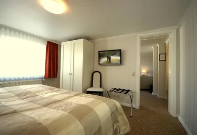 Ein Bett oder Betten in einem Zimmer der Unterkunft Hotel Beckröge