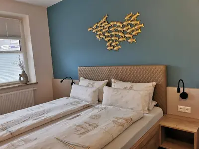 Ein Bett oder Betten in einem Zimmer der Unterkunft Hotel Deichvoigt