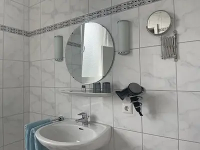 Ein Badezimmer in der Unterkunft Hotel Deichvoigt