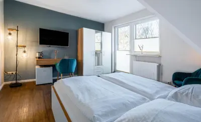 Ein Bett oder Betten in einem Zimmer der Unterkunft Hotel Luina Beach