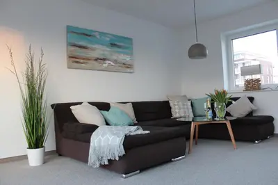 Ein Sitzbereich in der Unterkunft Ferienhaus Hafenzeit