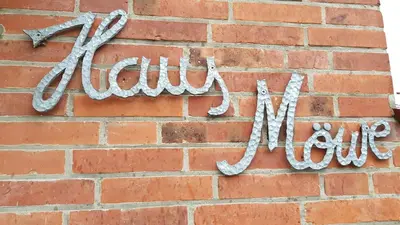 Ein Zertifikat, Auszeichnung, Logo oder anderes Dokument, das in der Unterkunft Ferienwohnung Haus Möwe ausgestellt ist