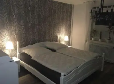 Ein Bett oder Betten in einem Zimmer der Unterkunft Feriendomizil im Musikerviertel in Otterndorf