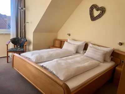 Ein Bett oder Betten in einem Zimmer der Unterkunft Pension Maren