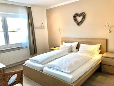 Ein Bett oder Betten in einem Zimmer der Unterkunft Pension Maren