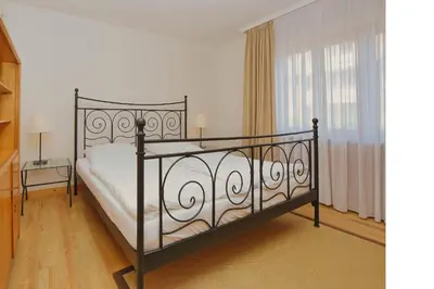 Ein Bett oder Betten in einem Zimmer der Unterkunft Stranddomicil Steiner - Gästehäuser