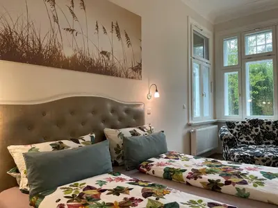 Ein Bett oder Betten in einem Zimmer der Unterkunft Villa Deichvoigt