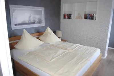 Ein Bett oder Betten in einem Zimmer der Unterkunft Terrassenhaus Penthouse-Wohnung 93