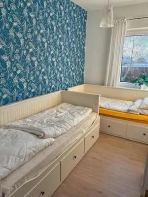 Ein Bett oder Betten in einem Zimmer der Unterkunft Ferienhaus Lemafri Duhnen