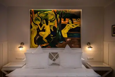 Ein Bett oder Betten in einem Zimmer der Unterkunft Beachhotel Cuxhaven