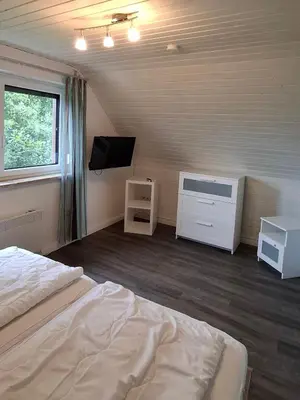 Ein Bett oder Betten in einem Zimmer der Unterkunft Ferienhaus Sander