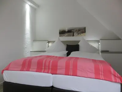 Ein Bett oder Betten in einem Zimmer der Unterkunft dat geele hus 5