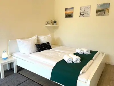 Ein Bett oder Betten in einem Zimmer der Unterkunft Frauenpreiss Whg. 56