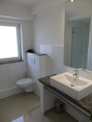 Ein Badezimmer in der Unterkunft dat geele hus Wohnung 6