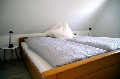 Ein Bett oder Betten in einem Zimmer der Unterkunft Heidhöhn 8