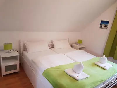 Ein Bett oder Betten in einem Zimmer der Unterkunft Ferienwohnung Nordwind