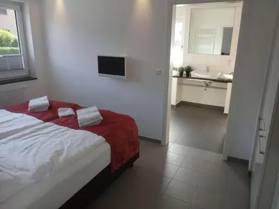 Ein Bett oder Betten in einem Zimmer der Unterkunft dat witte hus 1