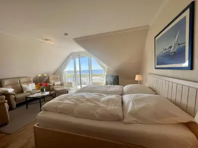 Ein Bett oder Betten in einem Zimmer der Unterkunft Stranddomicil Steiner
