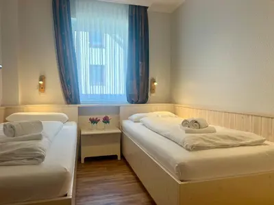 Ein Bett oder Betten in einem Zimmer der Unterkunft Stranddomicil Steiner