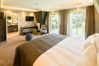Ein Bett oder Betten in einem Zimmer der Unterkunft Pura Vida Hotel Cuxhaven