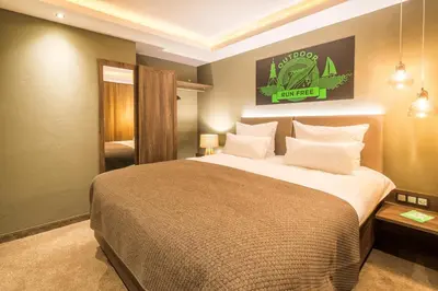 Ein Bett oder Betten in einem Zimmer der Unterkunft Pura Vida Hotel Cuxhaven