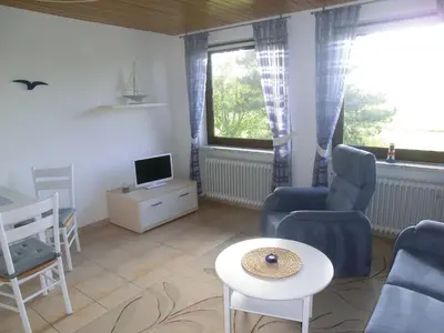 Ein Sitzbereich in der Unterkunft Haus Strandgut/2