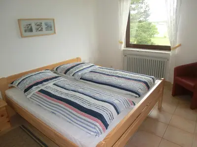 Ein Bett oder Betten in einem Zimmer der Unterkunft Haus Strandgut/1