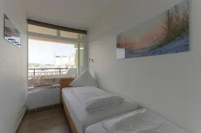 Ein Bett oder Betten in einem Zimmer der Unterkunft Christiansen im Panoramahaus Duhnen