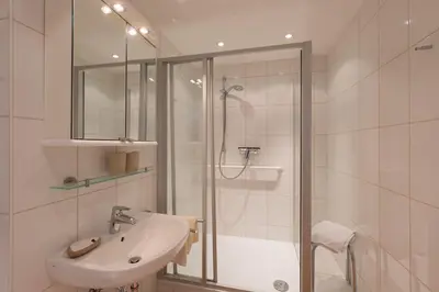 Ein Badezimmer in der Unterkunft Christiansen im Panoramahaus Duhnen