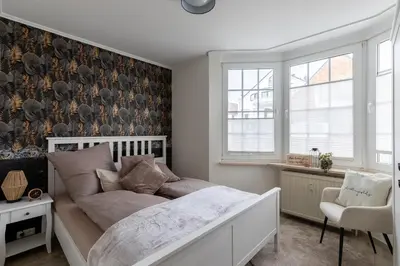 Ein Bett oder Betten in einem Zimmer der Unterkunft Fischerhus Wohnung 4