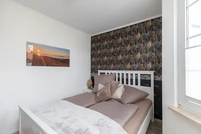 Ein Bett oder Betten in einem Zimmer der Unterkunft Fischerhus Wohnung 4