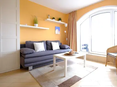 Ein Sitzbereich in der Unterkunft Ferienwohnung 348 Haus Deichgraf
