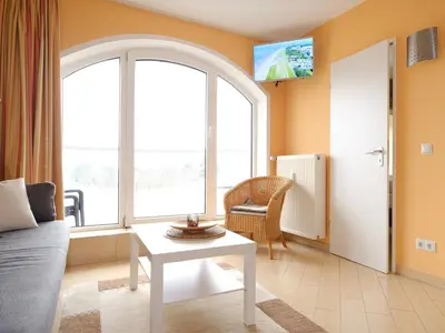 Ein Sitzbereich in der Unterkunft Ferienwohnung 348 Haus Deichgraf