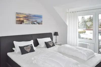 Ein Bett oder Betten in einem Zimmer der Unterkunft Strandläufer