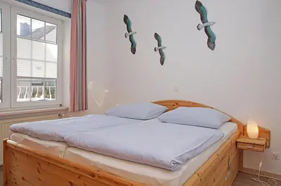 Ein Bett oder Betten in einem Zimmer der Unterkunft Fischerhus - Wohnung 3