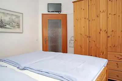 Ein Bett oder Betten in einem Zimmer der Unterkunft Fischerhus - Wohnung 3