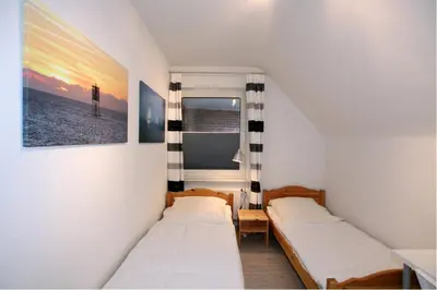 Ein Bett oder Betten in einem Zimmer der Unterkunft Neuwerk